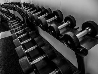 black and silver dumbbells on black steel rack